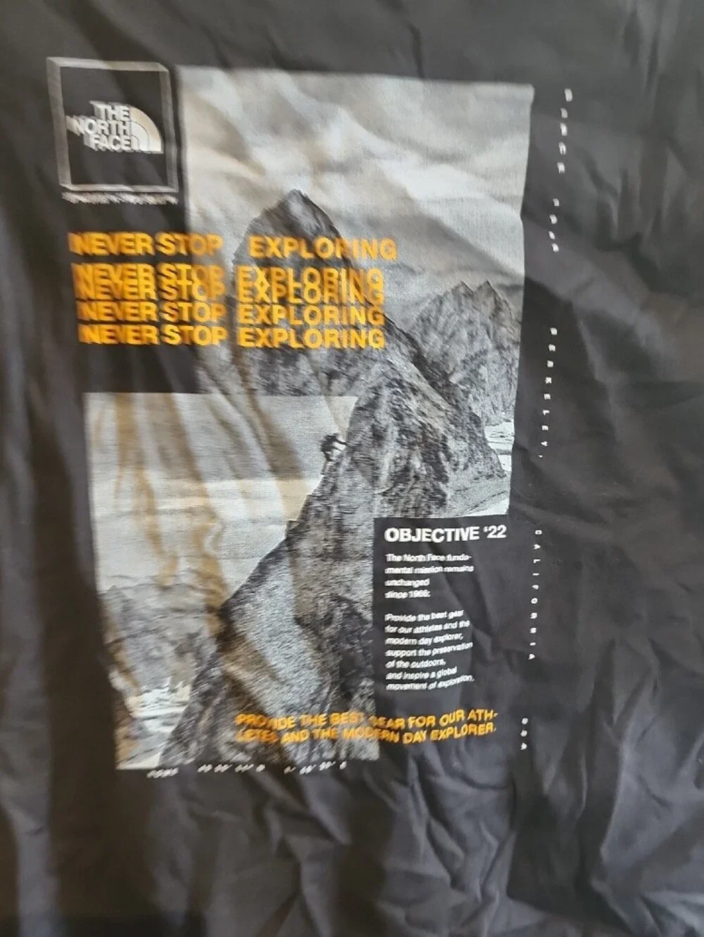 The North Face Men’s Black Short Sleeve Graphic Tee with Yellow Accent